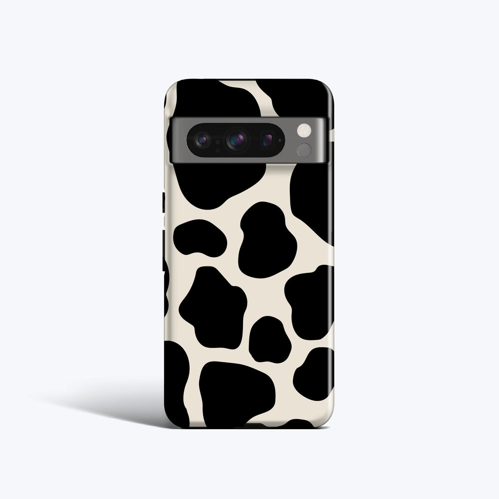 a cell phone case with a black and white cow print