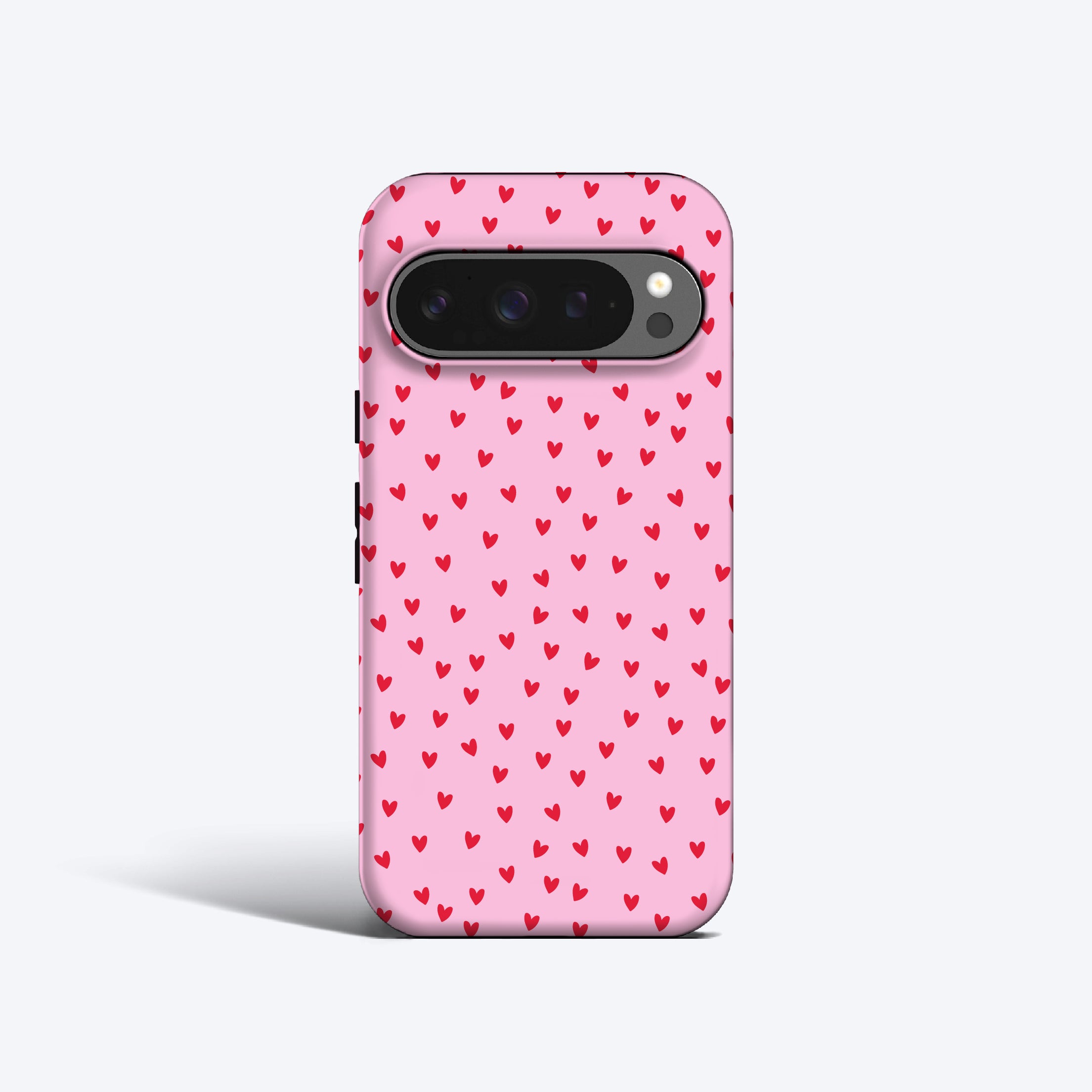 a pink phone case with hearts on it